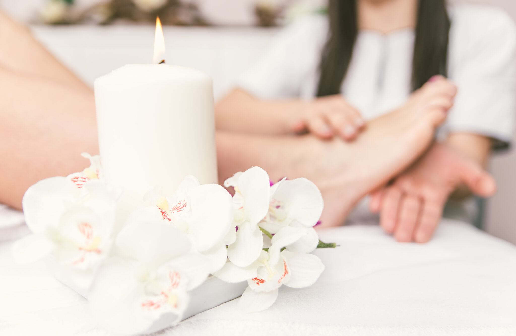 Close up of woman's feet and beauty saloon decorations